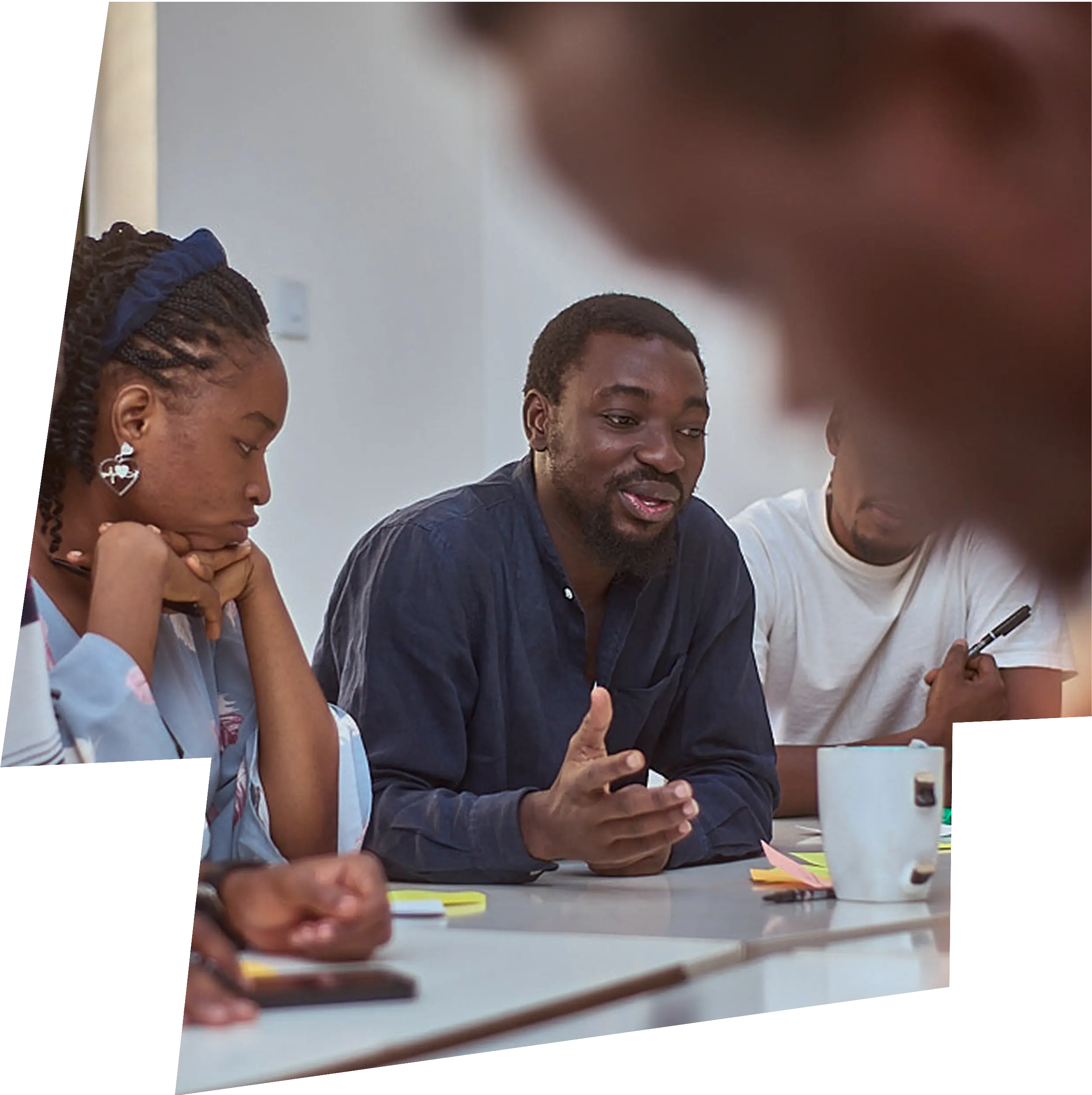 Yahaya Muhammad discussing design with a group of students